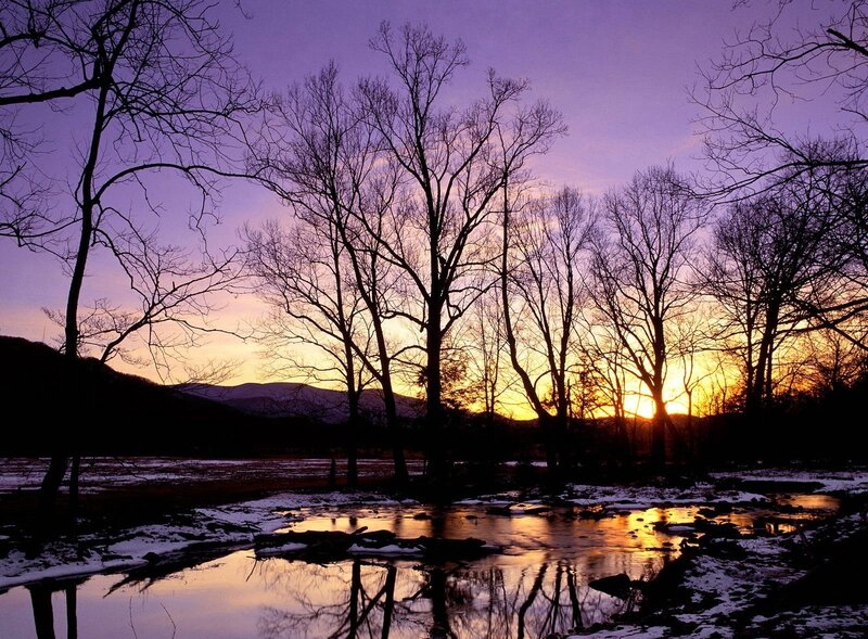 Sunset over a snowy river