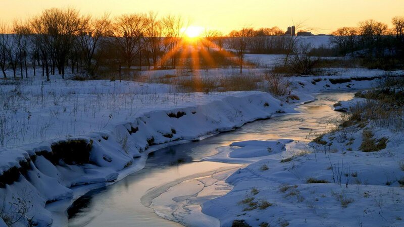 Sunset over a snowy river