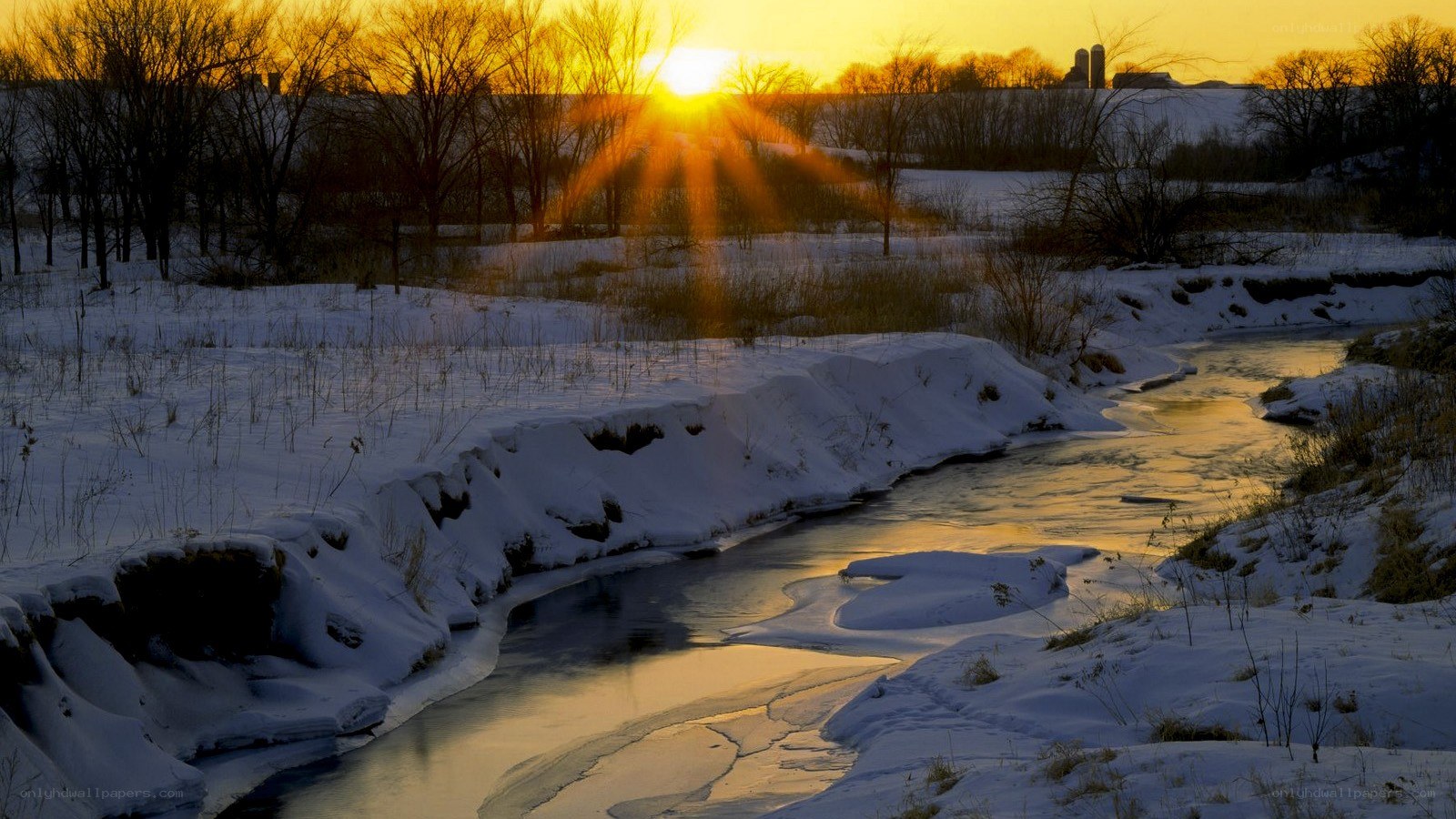Sunset over a snowy river