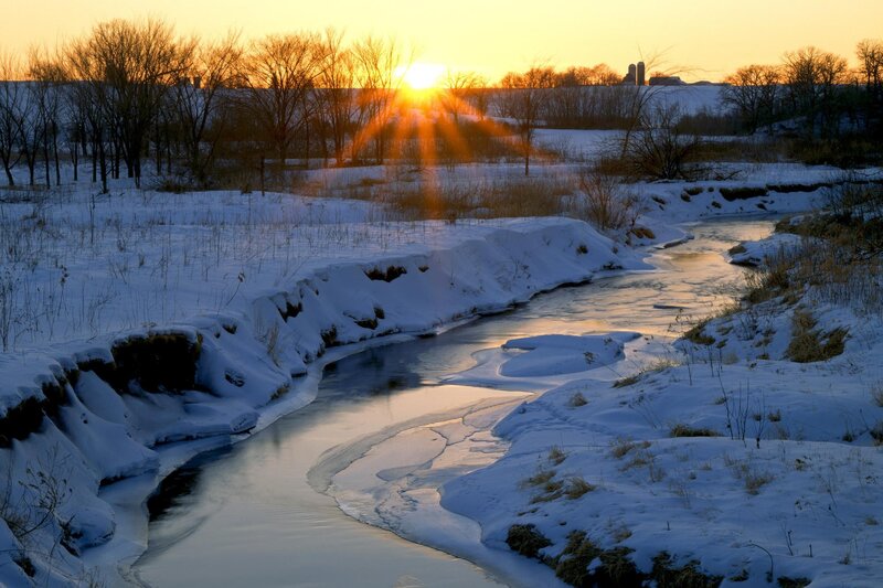 Sunset over a snowy river