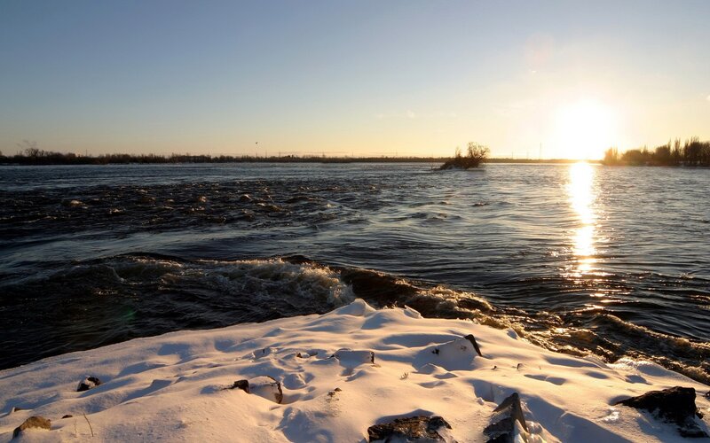 Sunset over a snowy river