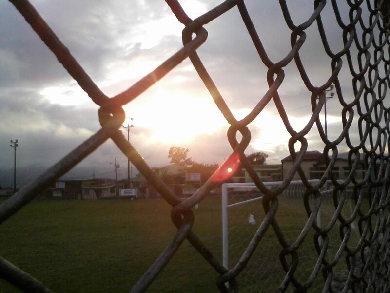sunset over a soccer field