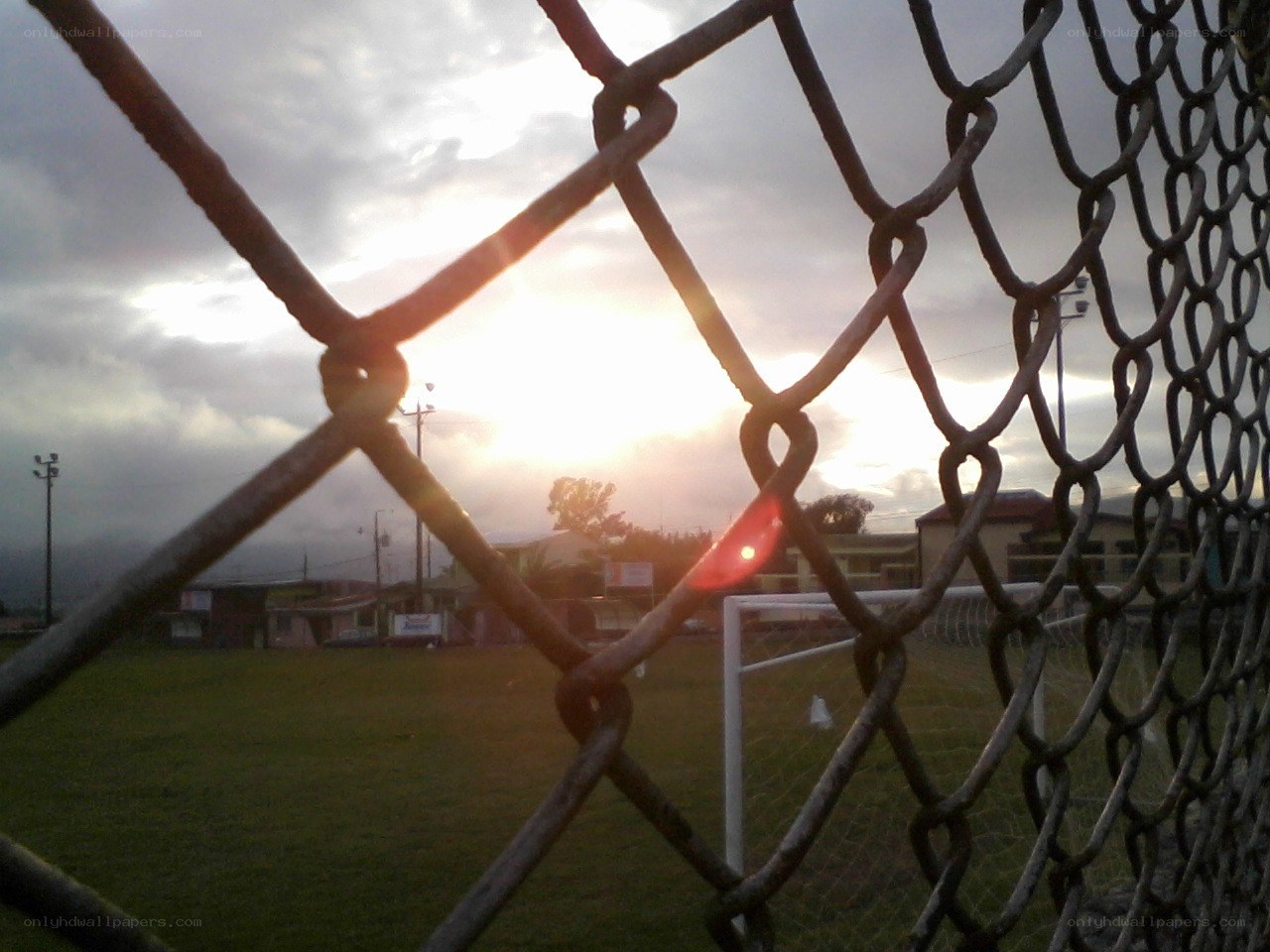 sunset over a soccer field