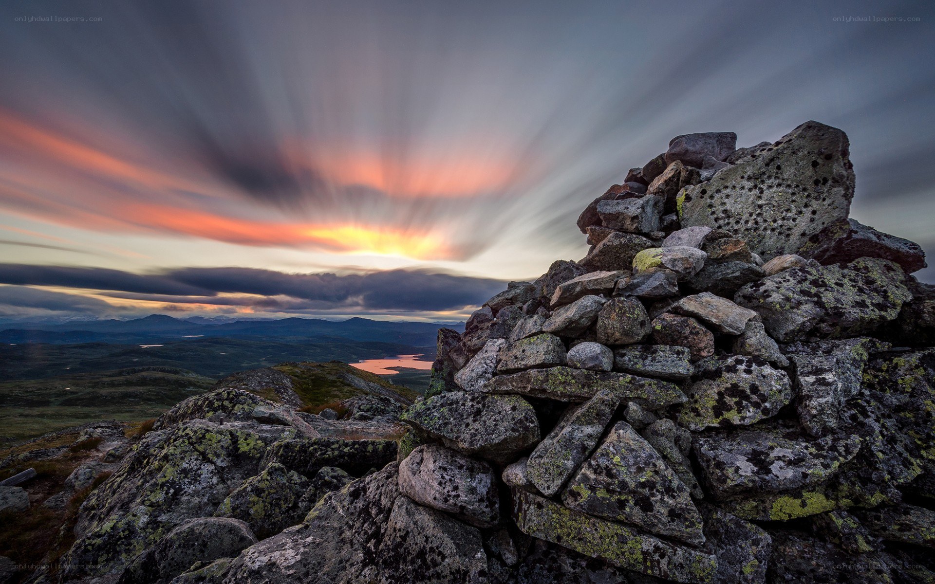 Sunset over a stone cairn
