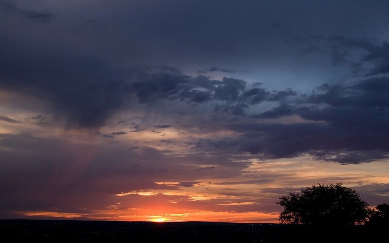 sunset over a stormy sky