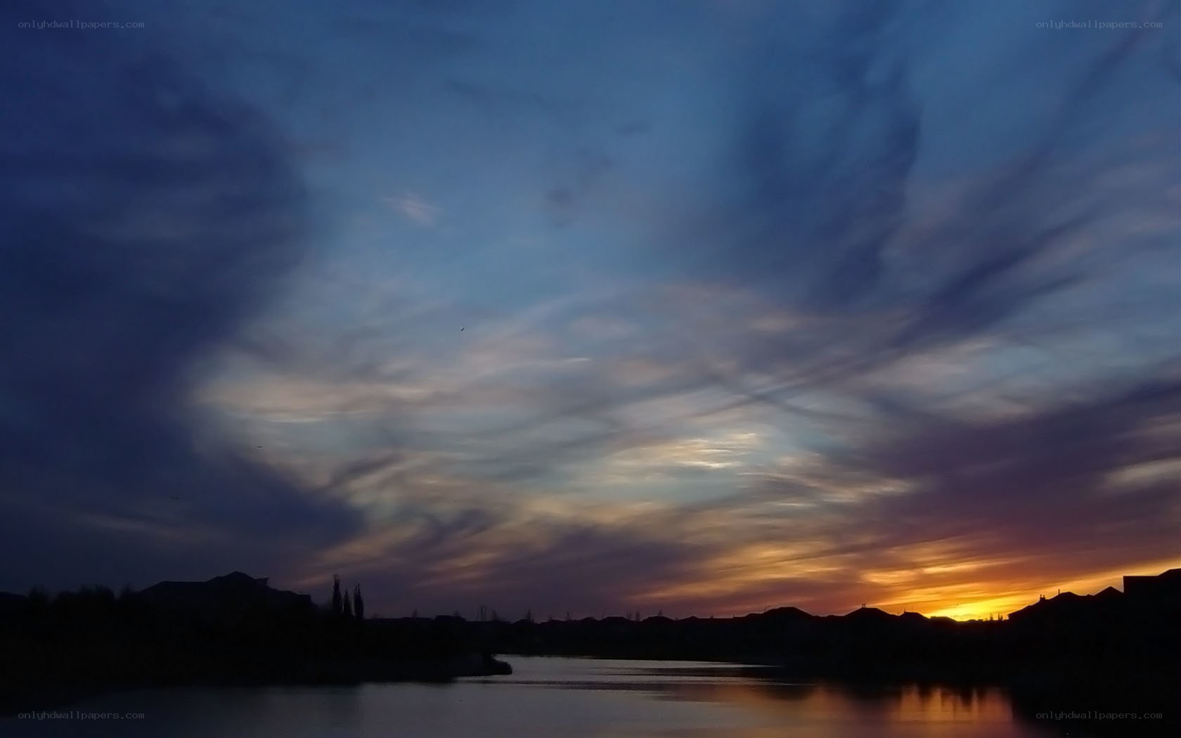 sunset over a suburban lake