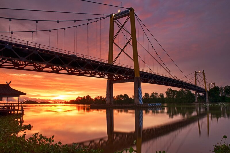 Sunset over a suspension bridge
