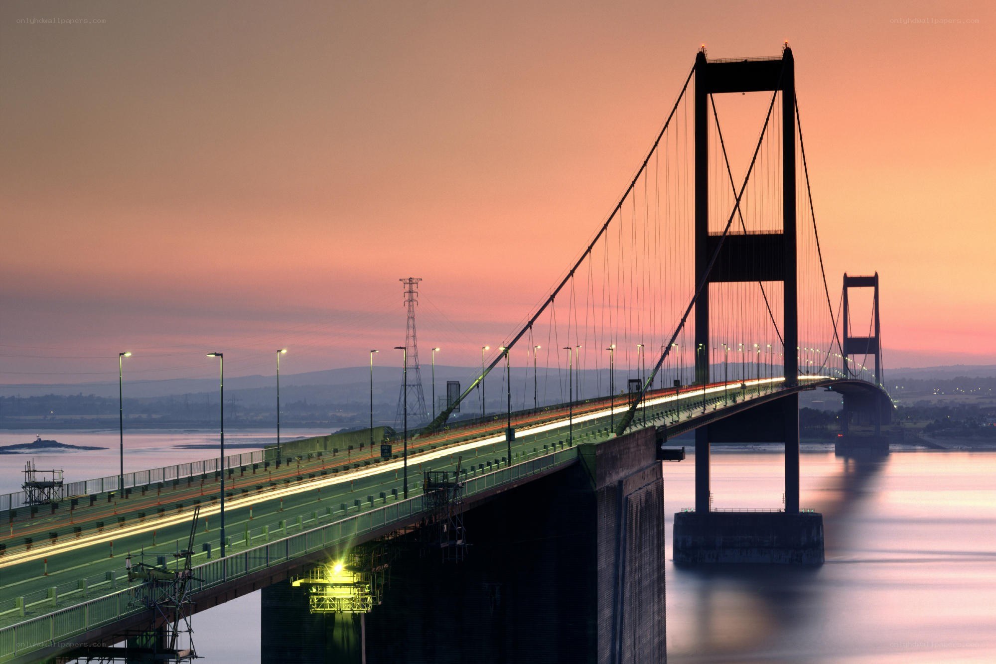 Sunset over a suspension bridge
