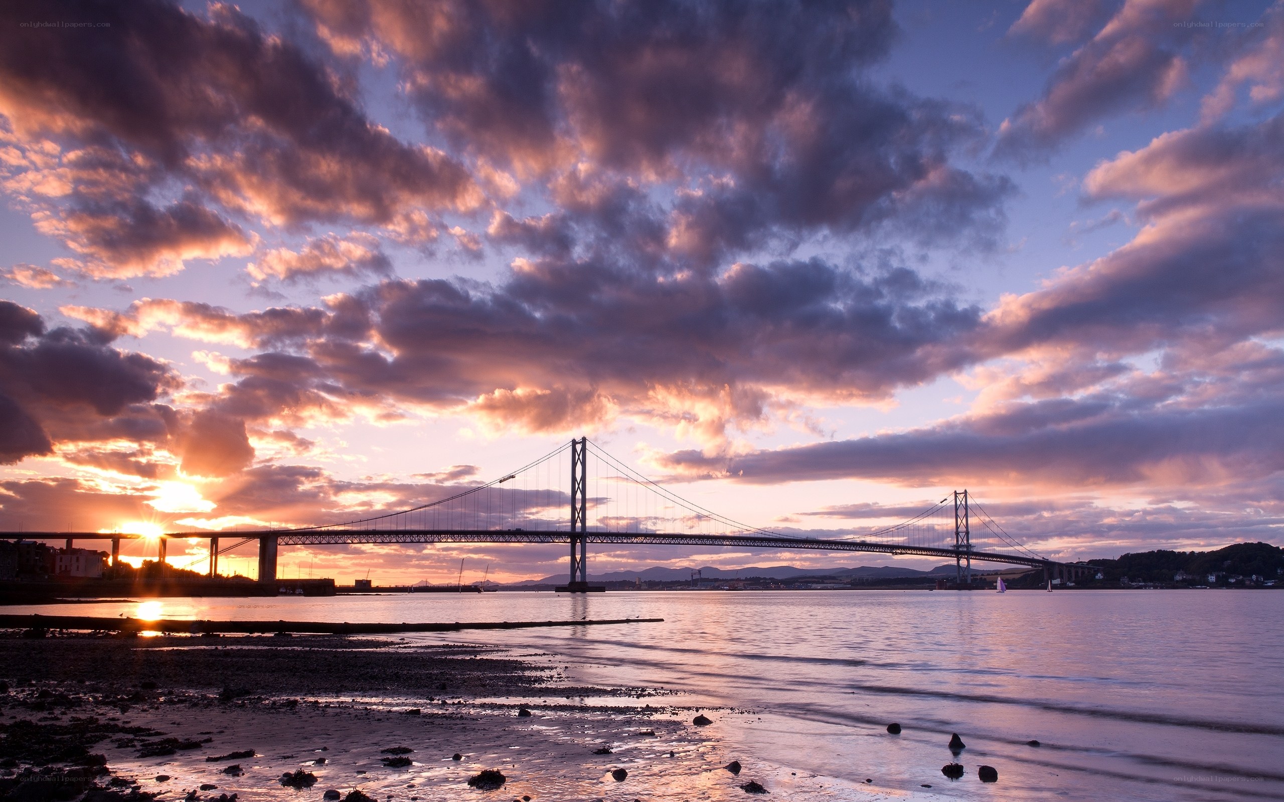 Sunset over a suspension bridge