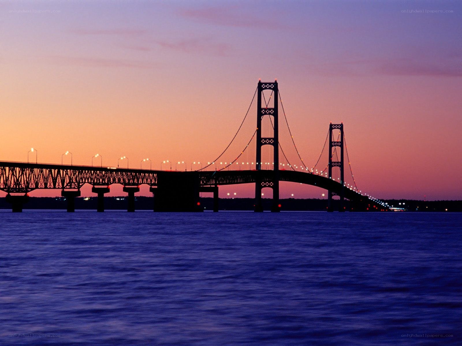 sunset over a suspension bridge