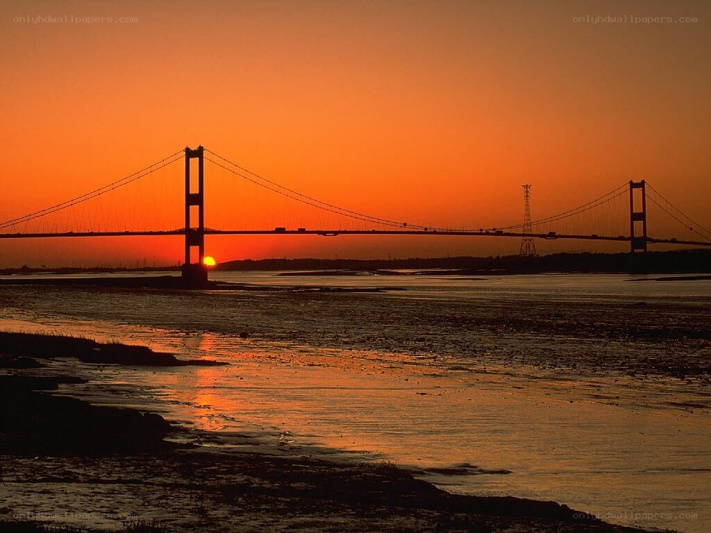 Sunset over a suspension bridge
