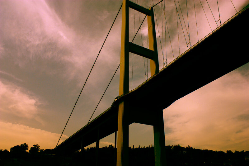 sunset over a suspension bridge
