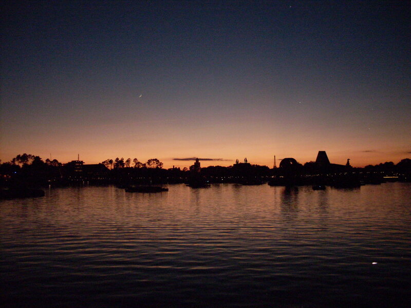 sunset over a theme park lake