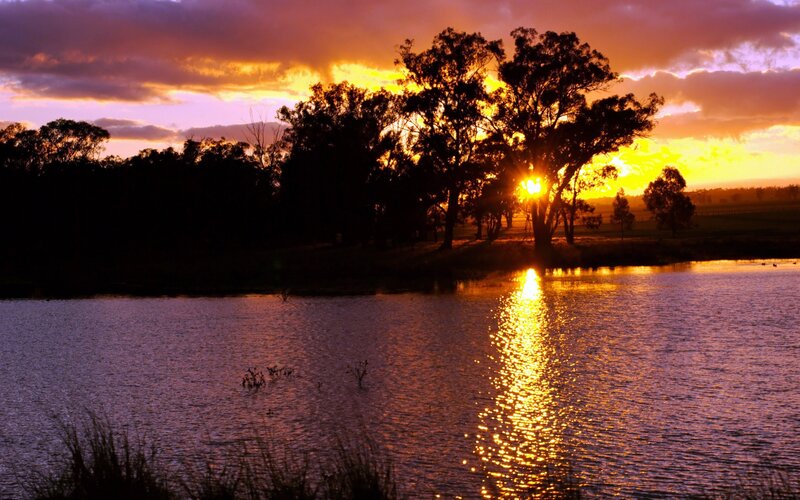 sunset over a tranquil lake