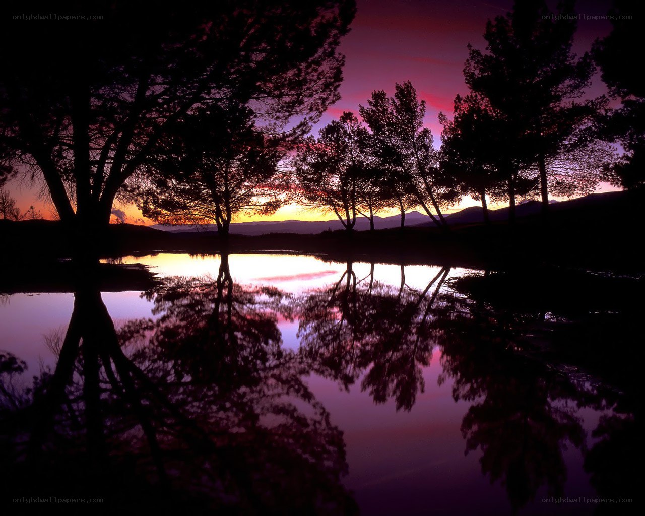 sunset over a tranquil lake