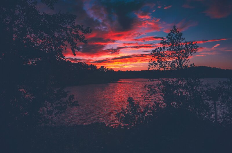 sunset over a tranquil lake