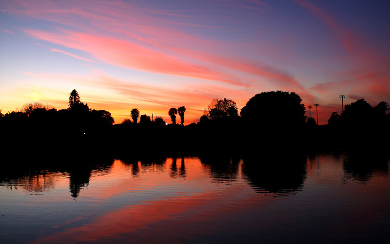 sunset over a tranquil lake