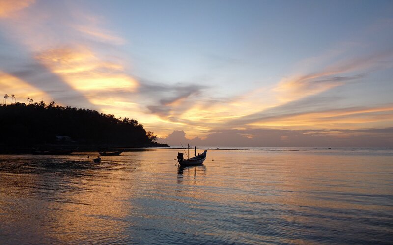 sunset over a tropical bay