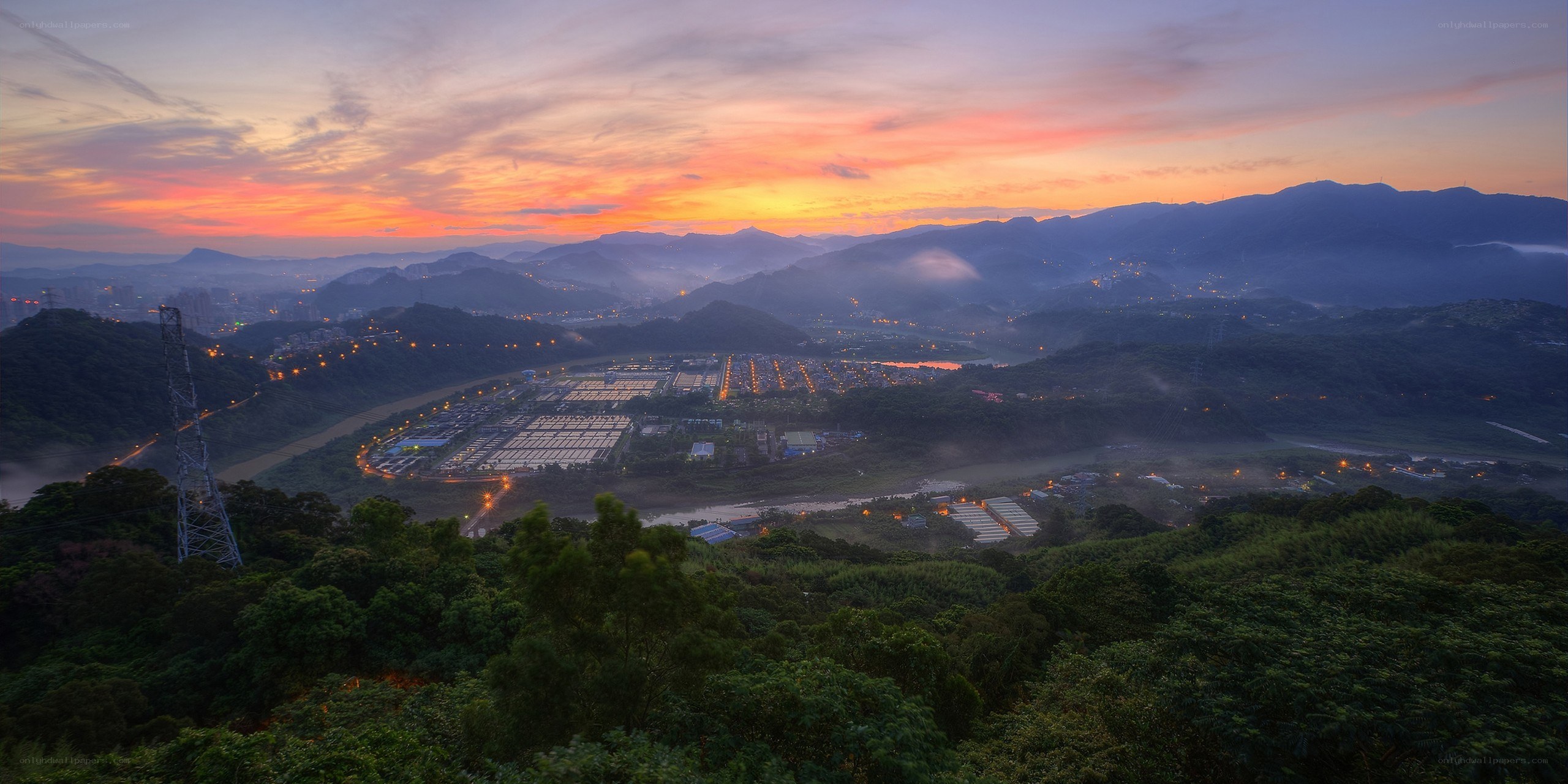 Sunset over a valley city