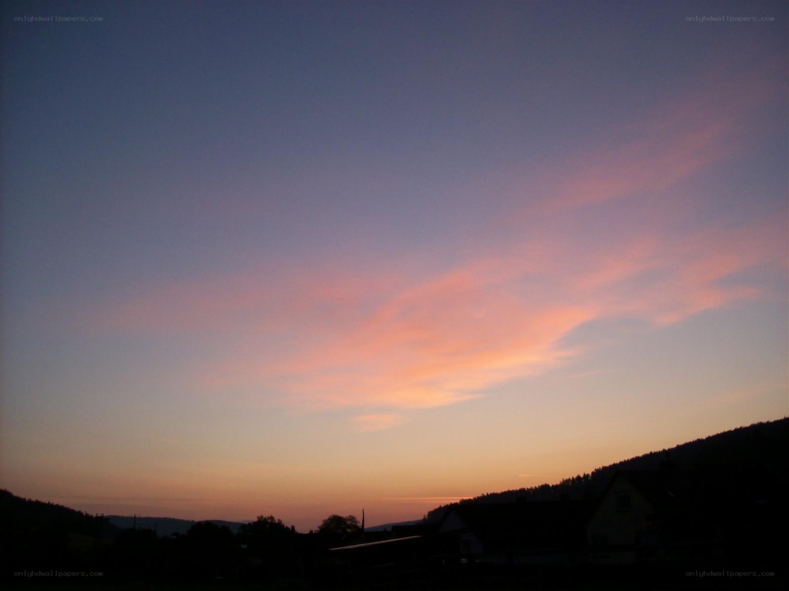 sunset over a village