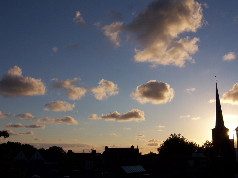 sunset over a village skyline