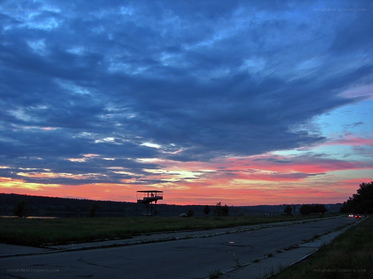 sunset over a watchtower