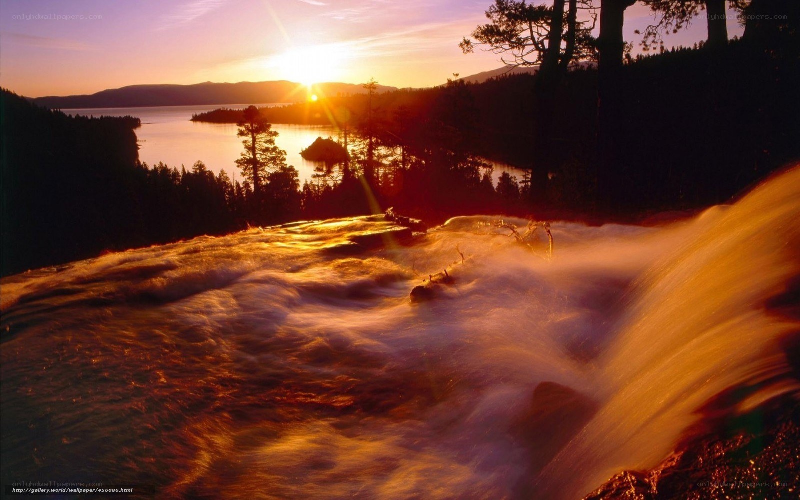 Sunset over a waterfall and lake