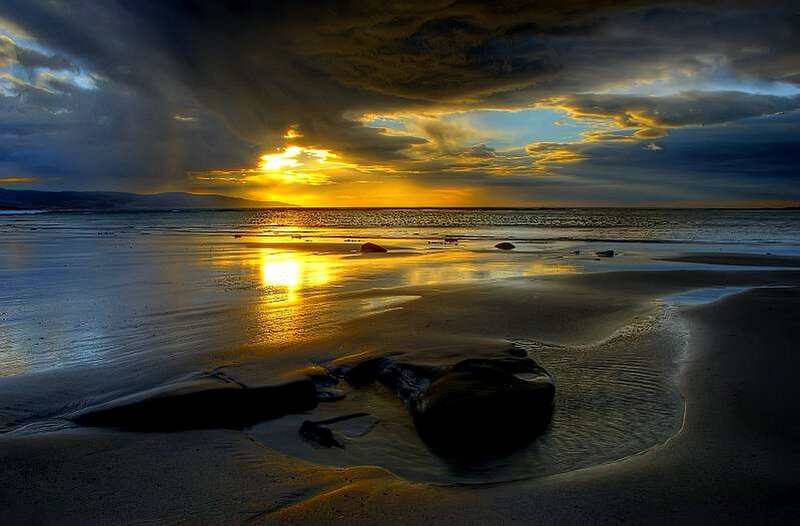 Sunset over a wet beach