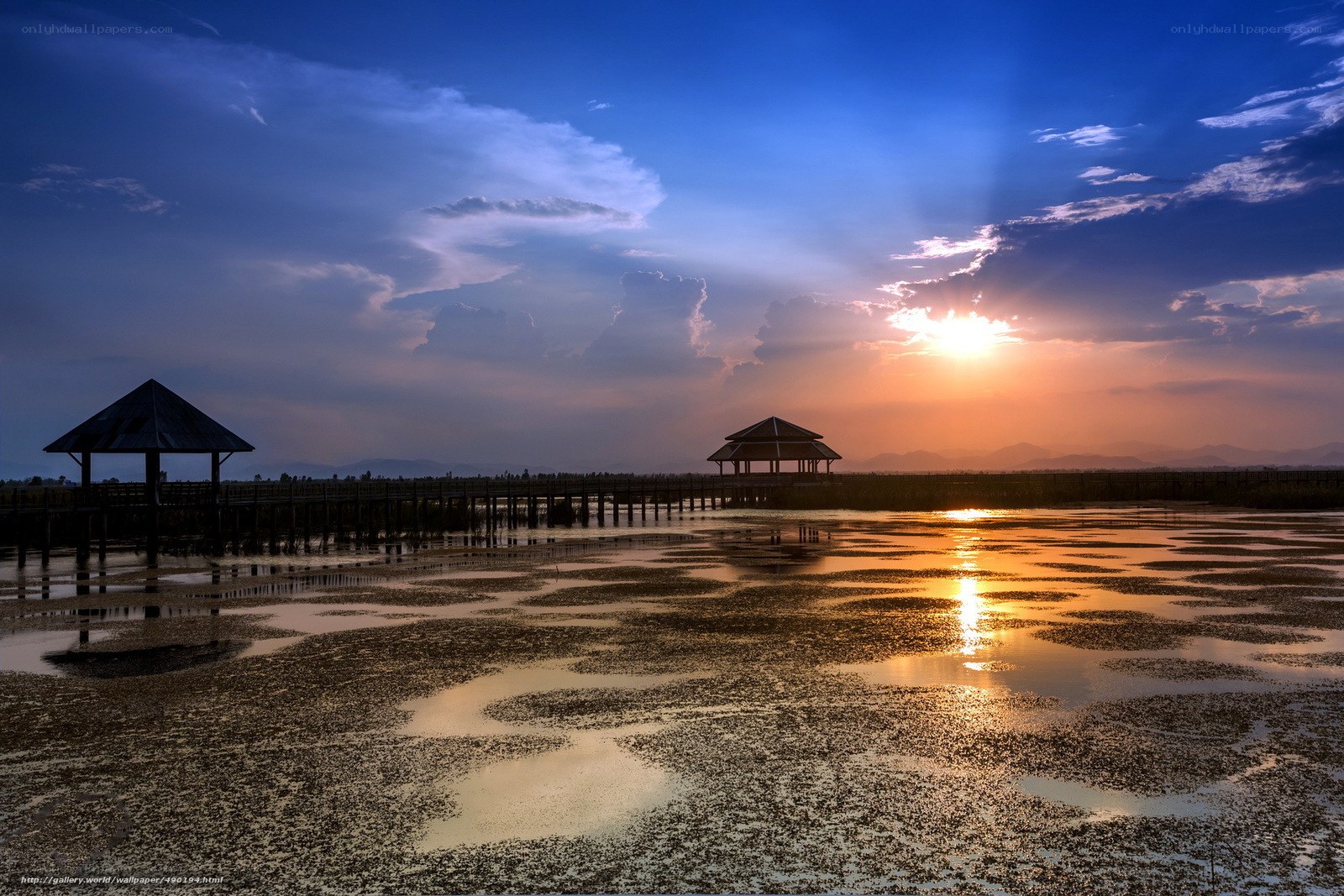 Sunset over a wetland with pavilions