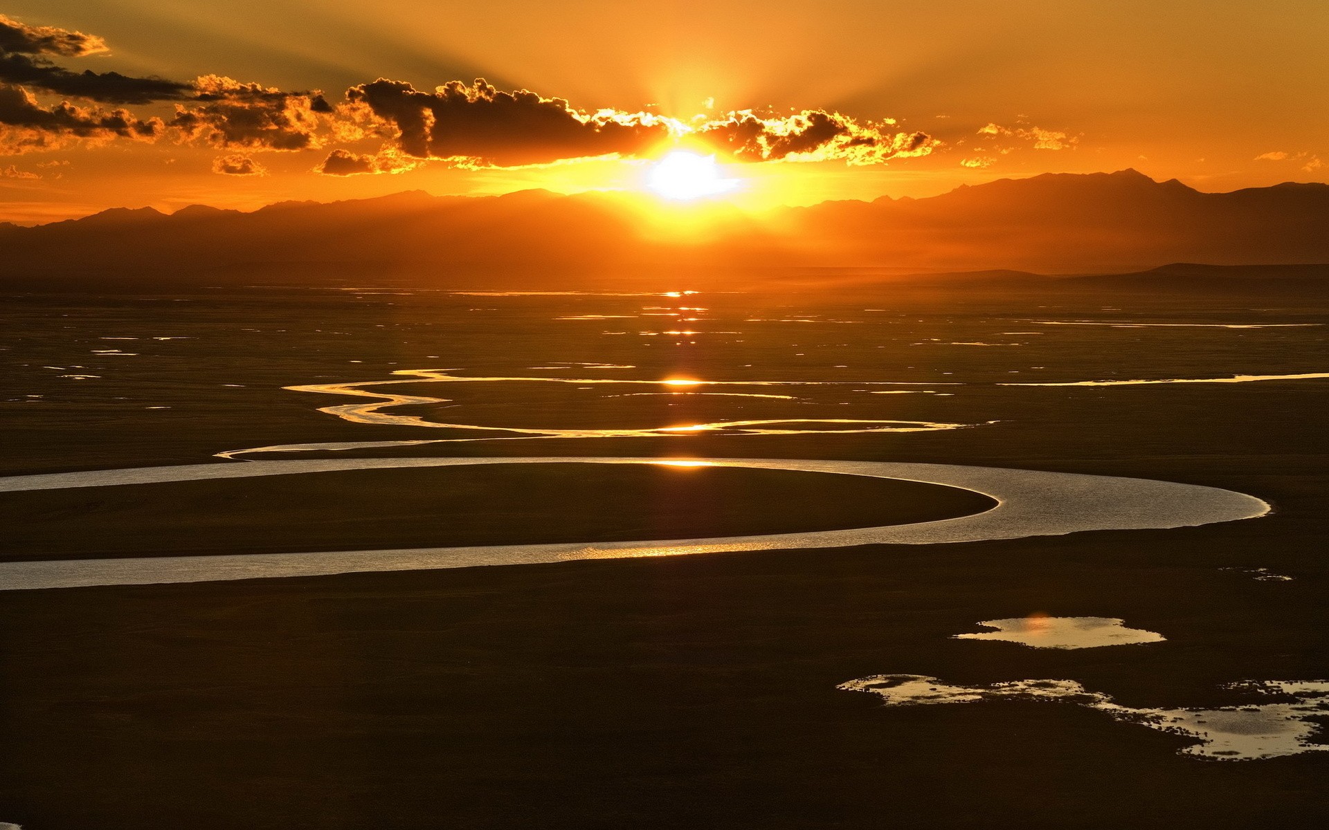 Sunset over a winding river