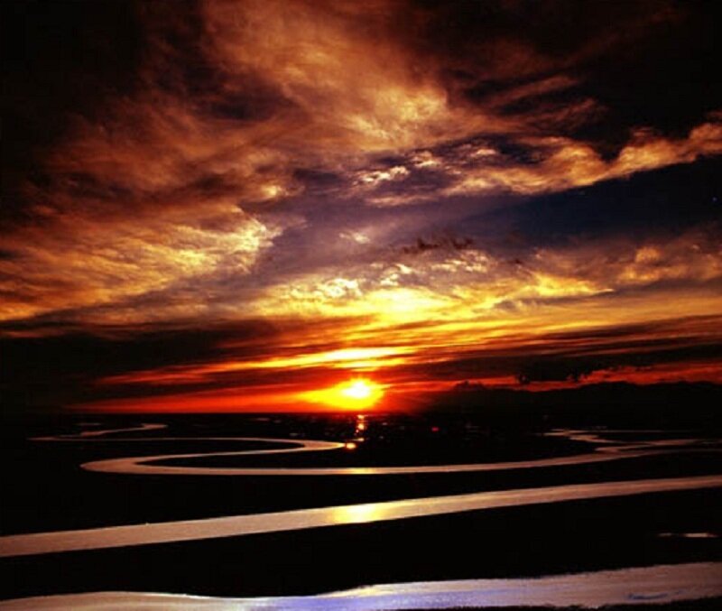 Sunset over a winding river