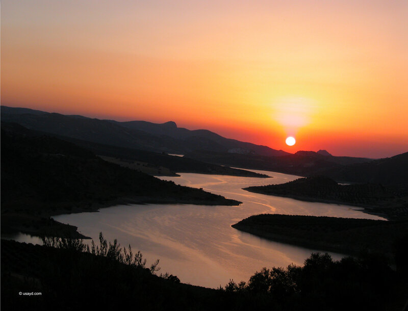 sunset over a winding river