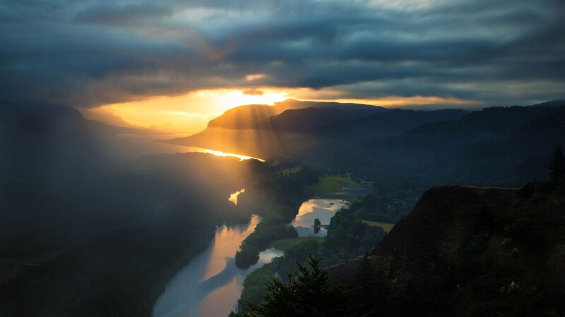 Sunset over a winding river valley