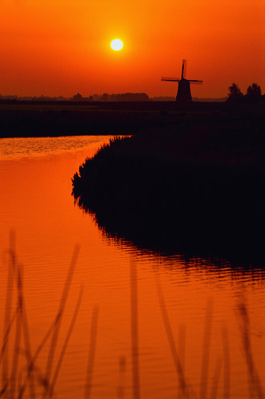 sunset over a windmill