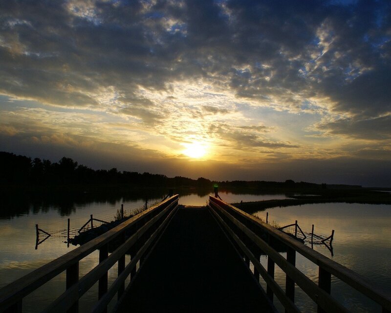 Sunset over a wooden bridge
