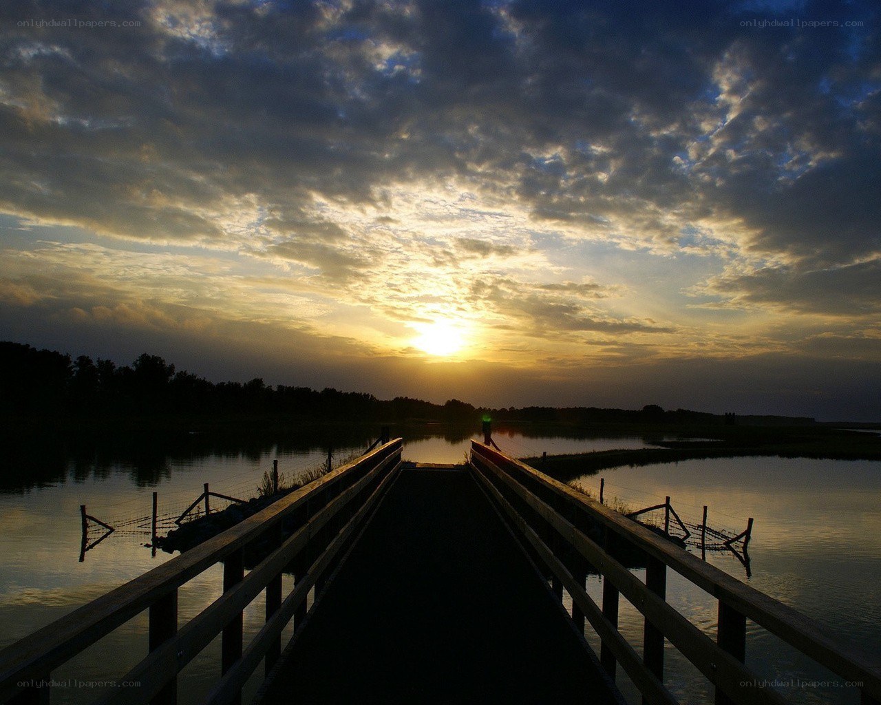 Sunset over a wooden bridge