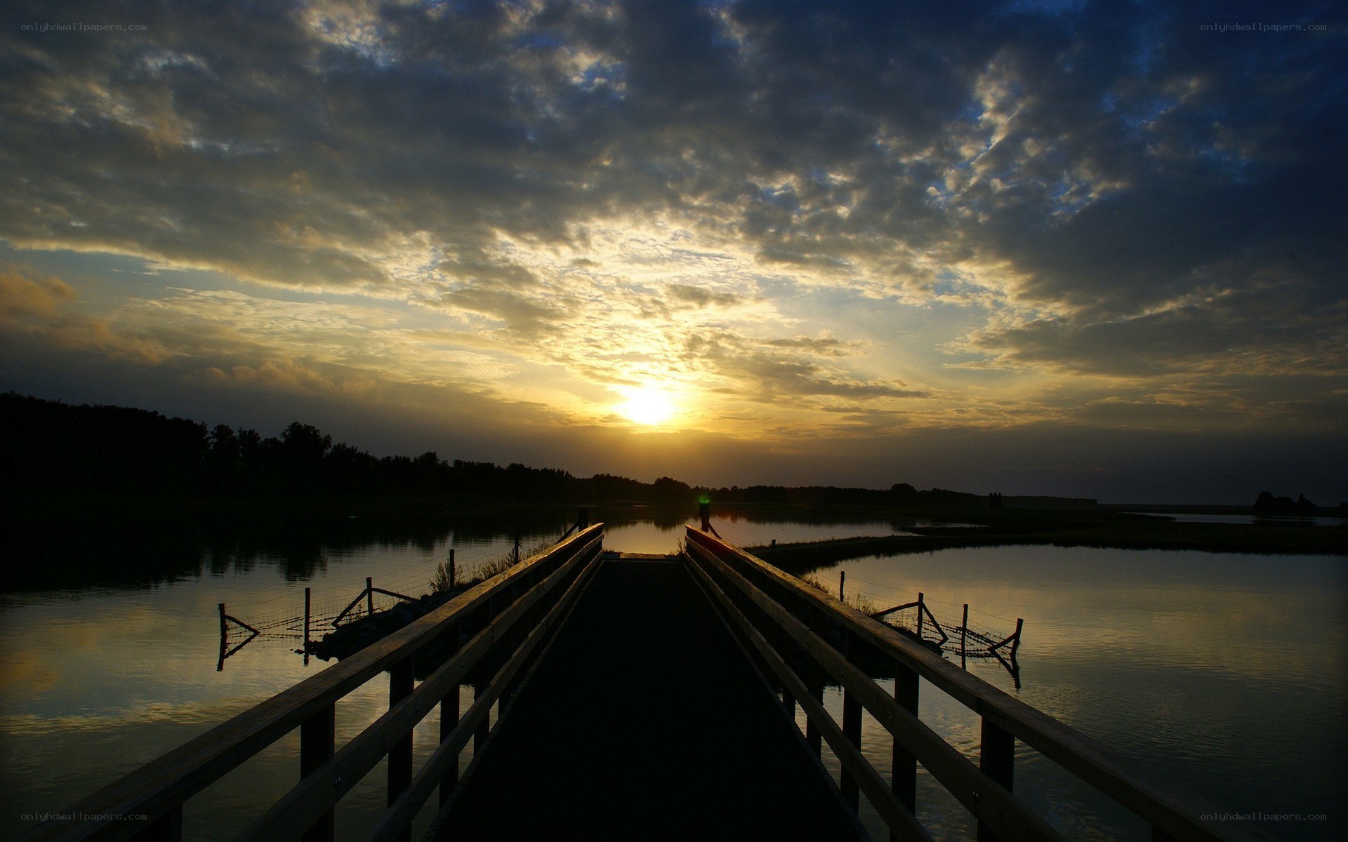 Sunset over a wooden bridge