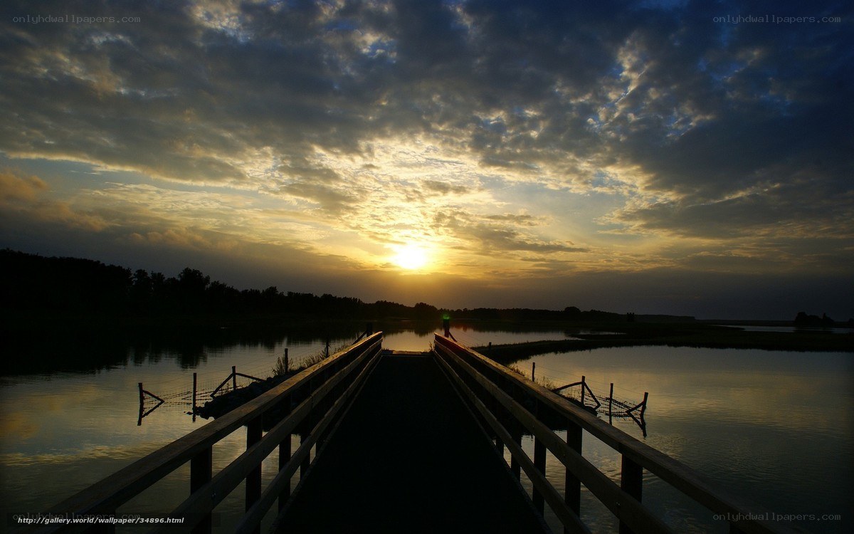 Sunset over a wooden bridge