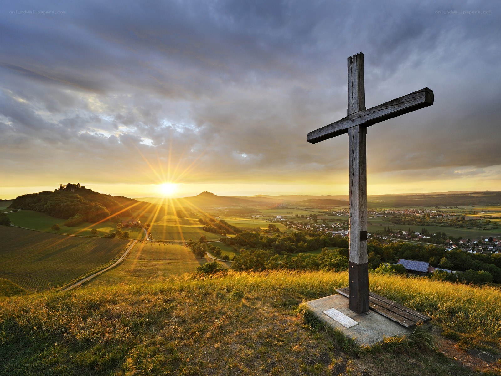 Sunset over a wooden cross