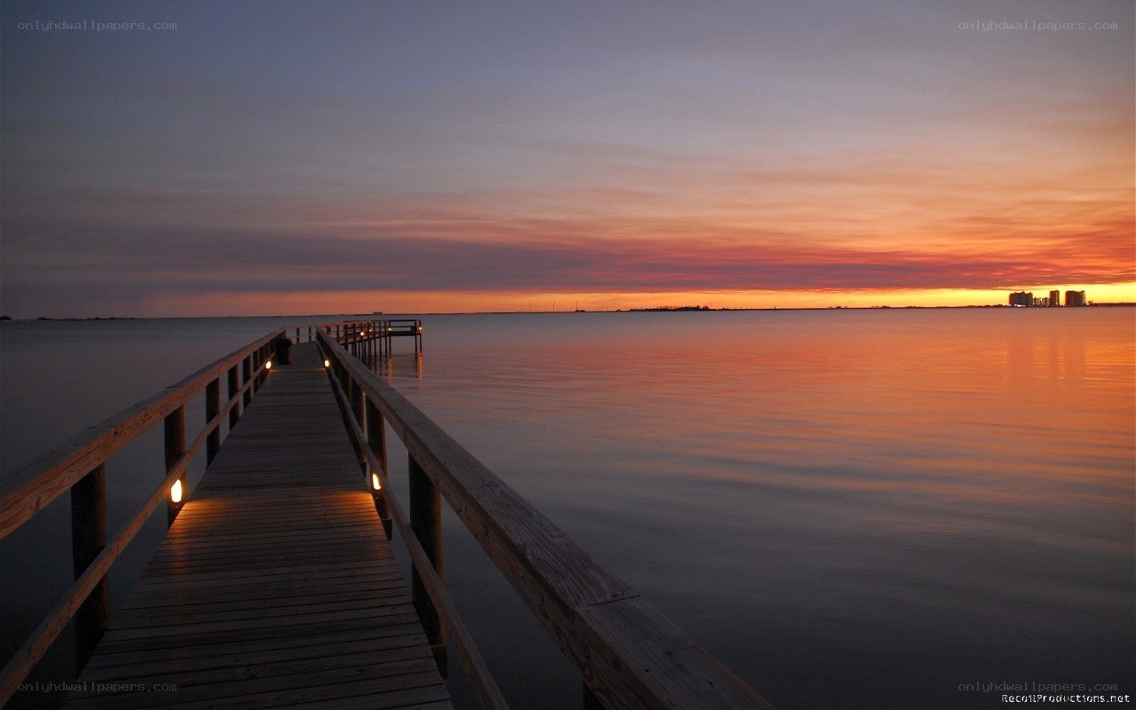 sunset over a wooden pier