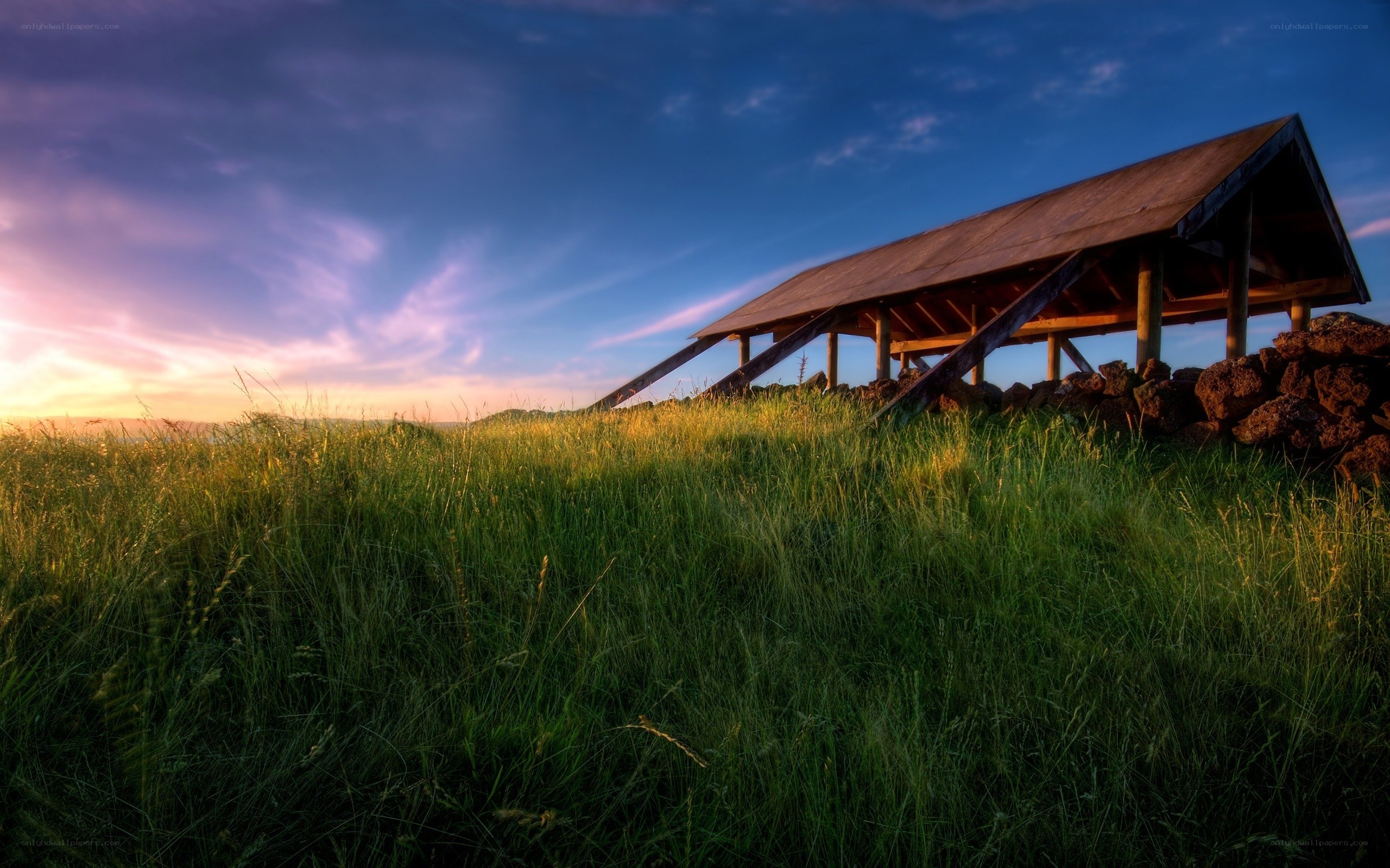 Sunset over a wooden shelter