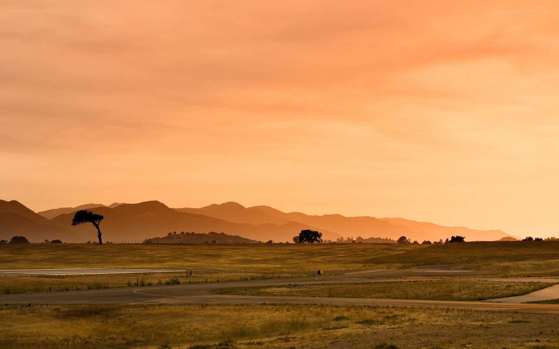 Sunset over airport runway