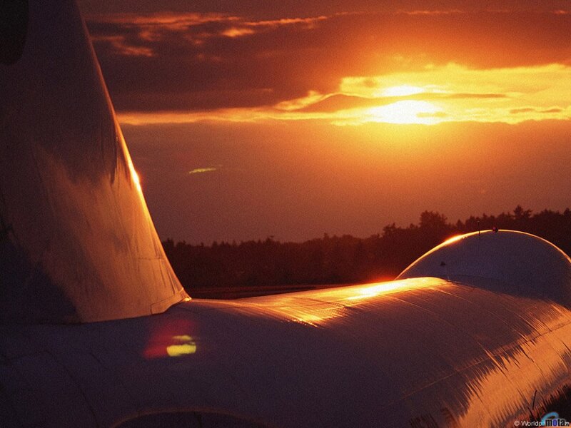 Sunset over an airplane wing
