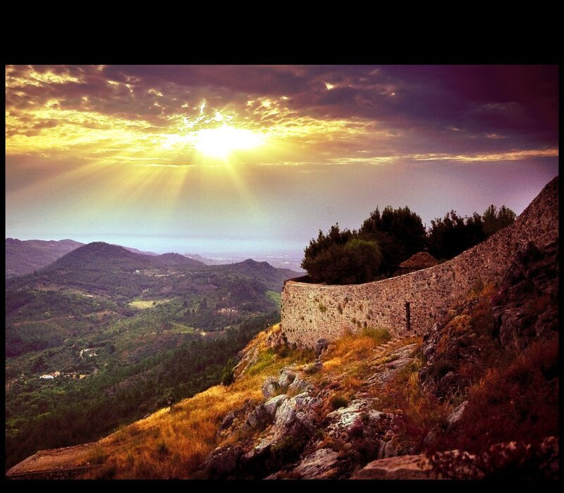 Sunset over ancient stone wall