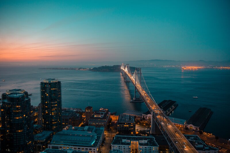 Sunset over Bay Bridge — Blue, Serene, Photograph, City Skyline