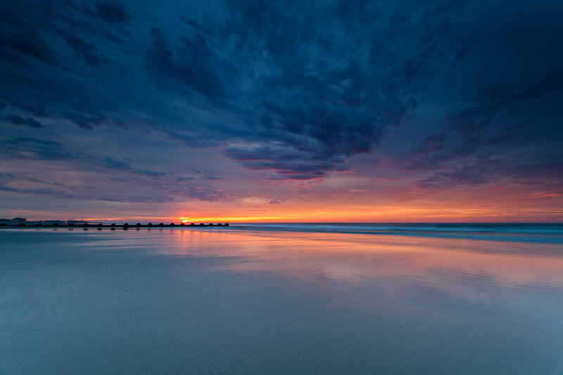 Sunset over Beach — Blue, Dramatic, Photograph, Ocean, Sky, Pier