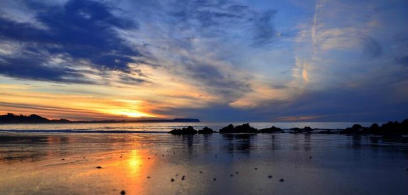 Sunset over Beach — Blue, Serene, Photograph, Ocean, Rocks