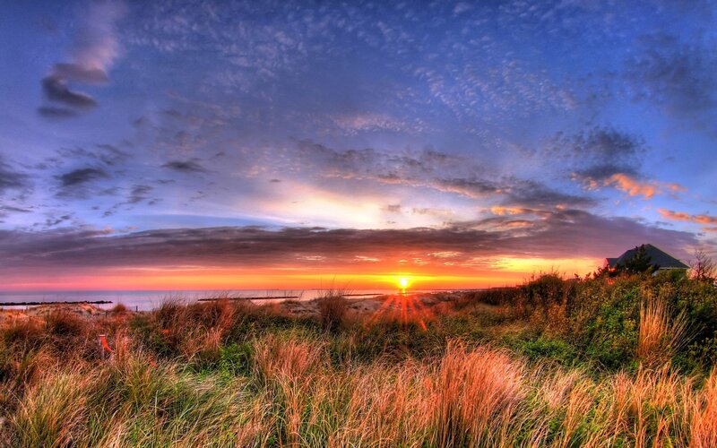 Sunset over Beach Dunes — Orange, Serene, Photograph, Sun, Ocean, Dune Grass, House