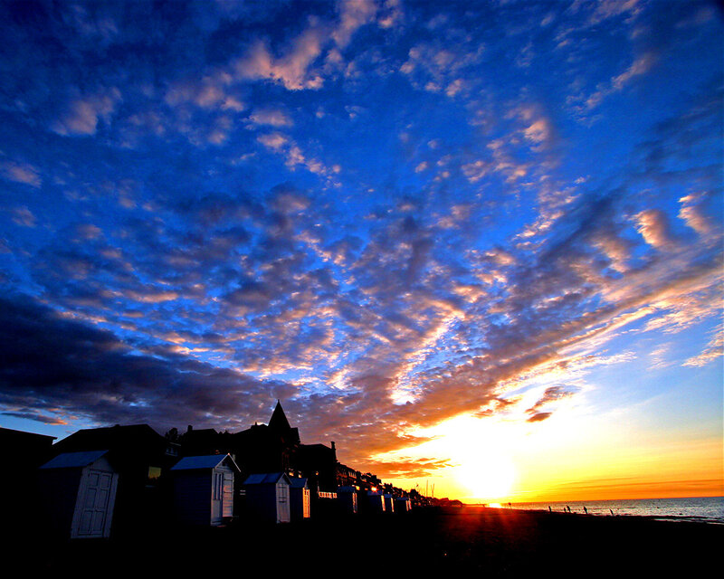 Sunset over beach huts