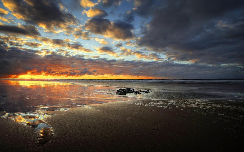 Sunset over Beach — Orange, Dramatic, Photograph, Clouds, Ocean, Sand
